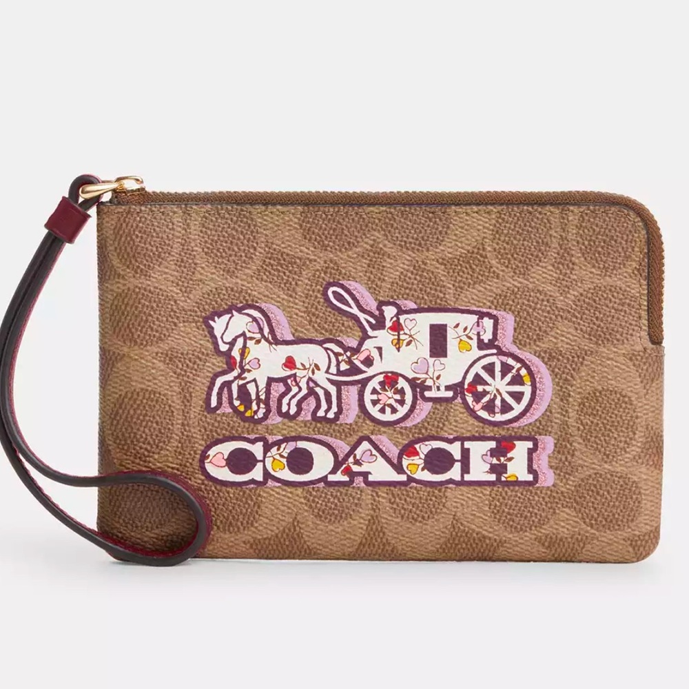 Coach CORNER ZIP WRISTLET IN SIGNATURE CANVAS WITH HORSE AND CARRIAGE PRINT